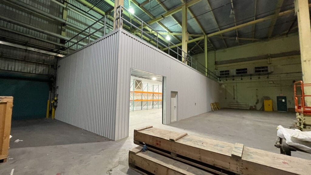 Empty industrial warehouse interior with metal partition