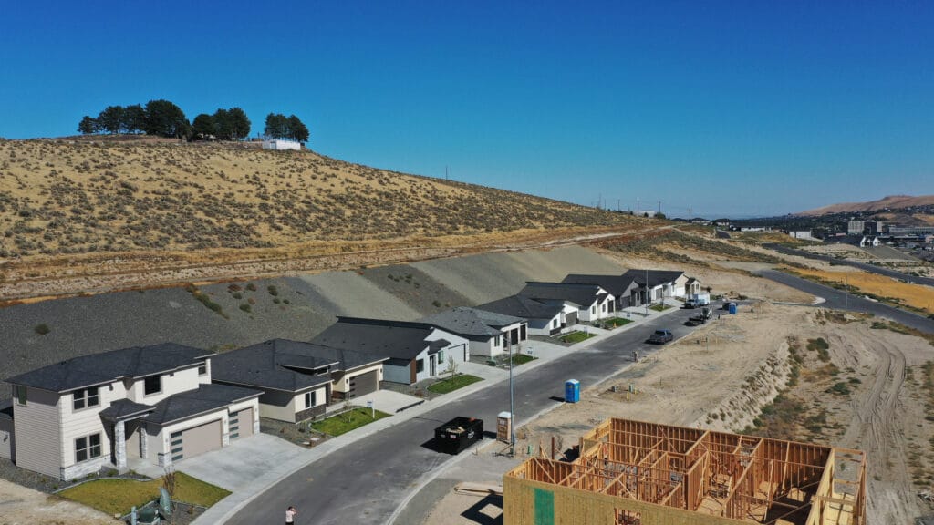 Construction site and modern houses in desert area.