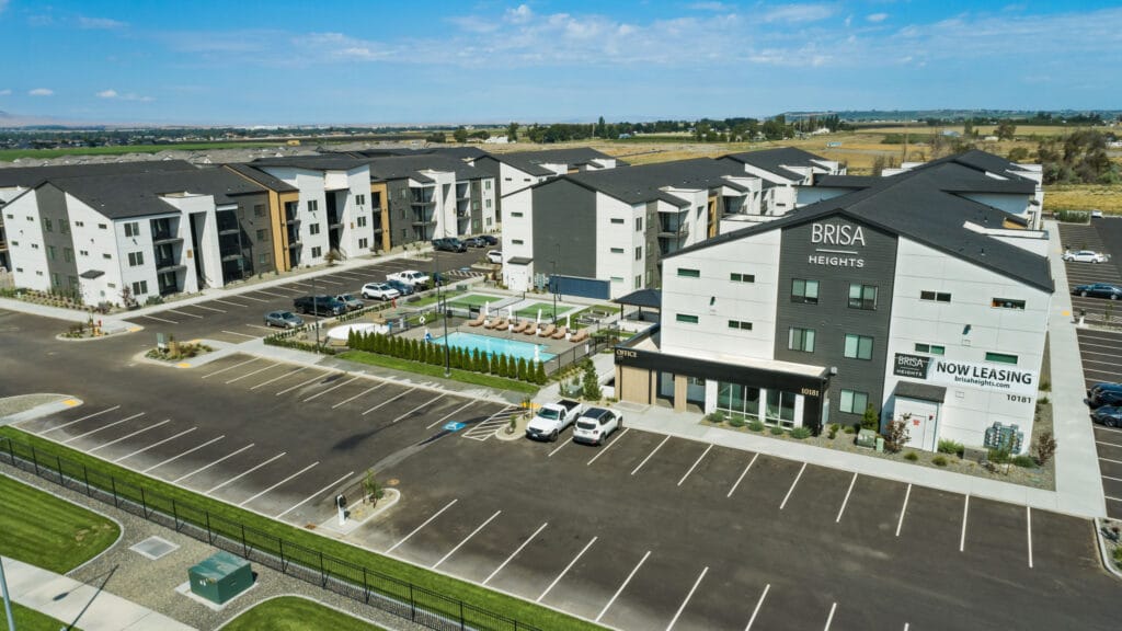 Brisa Heights apartment complex with parking and pool.