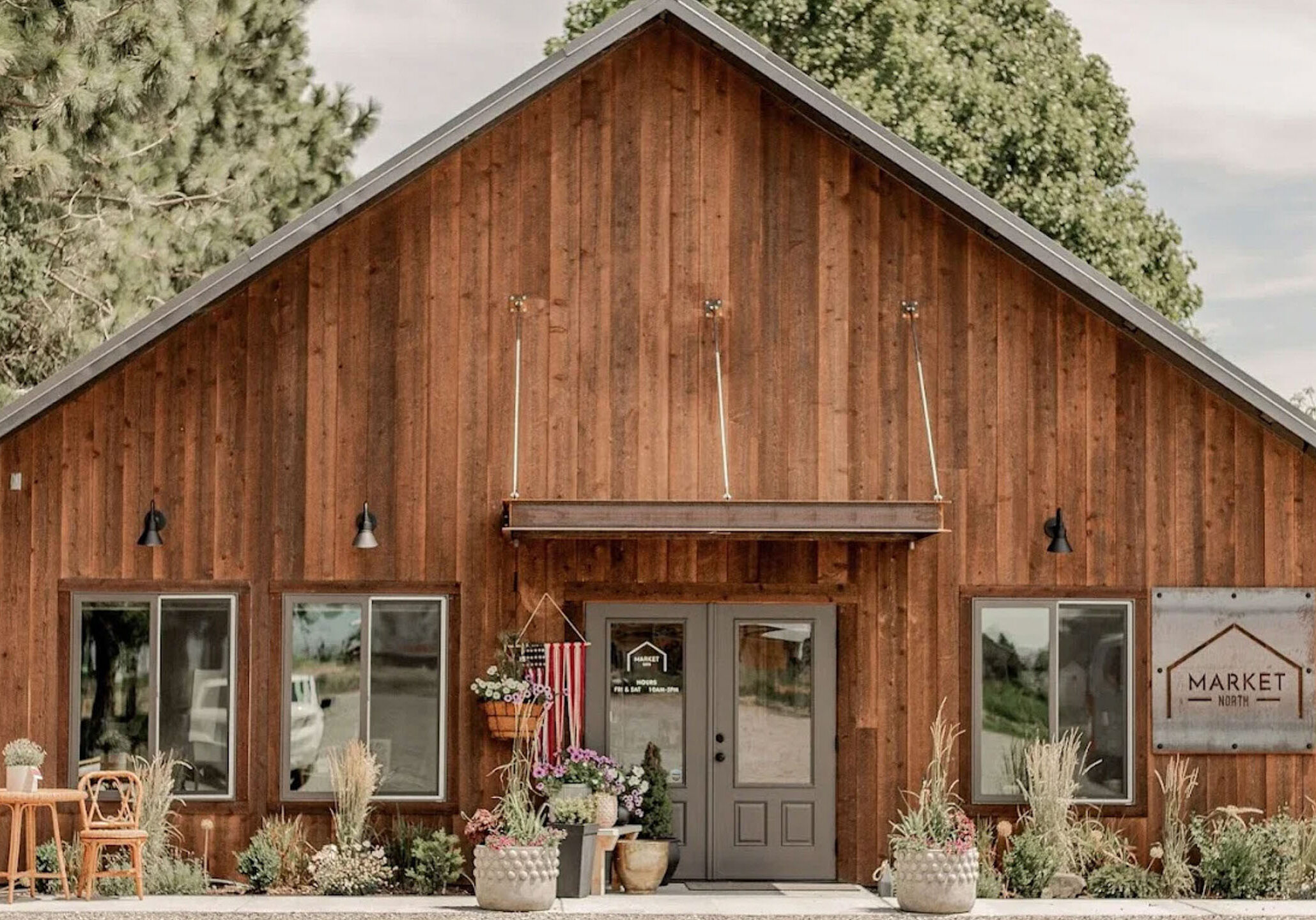 Rustic wooden building with sign 'Market North'.