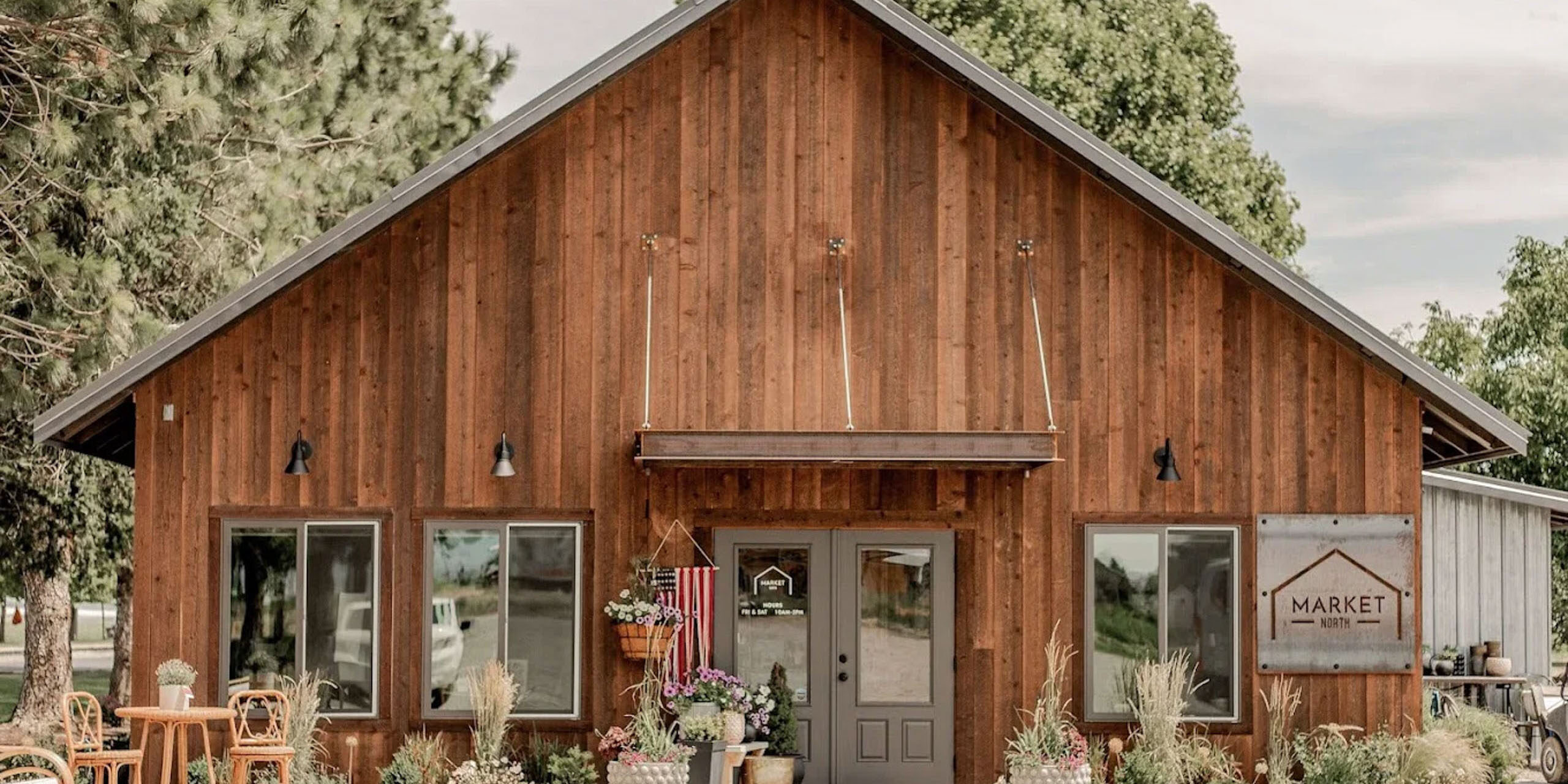 Rustic wooden building with sign 'Market North'.