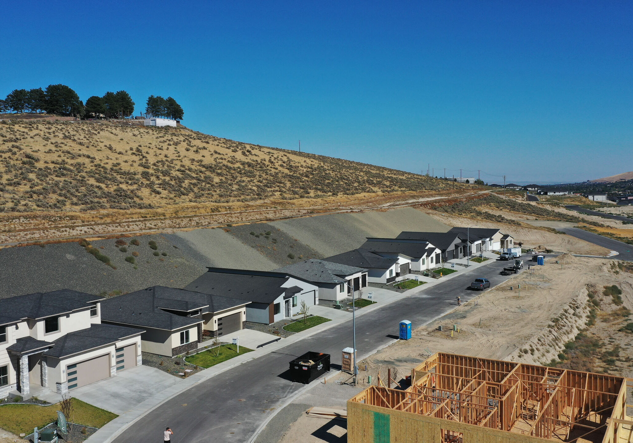 Construction site and modern houses in desert area.