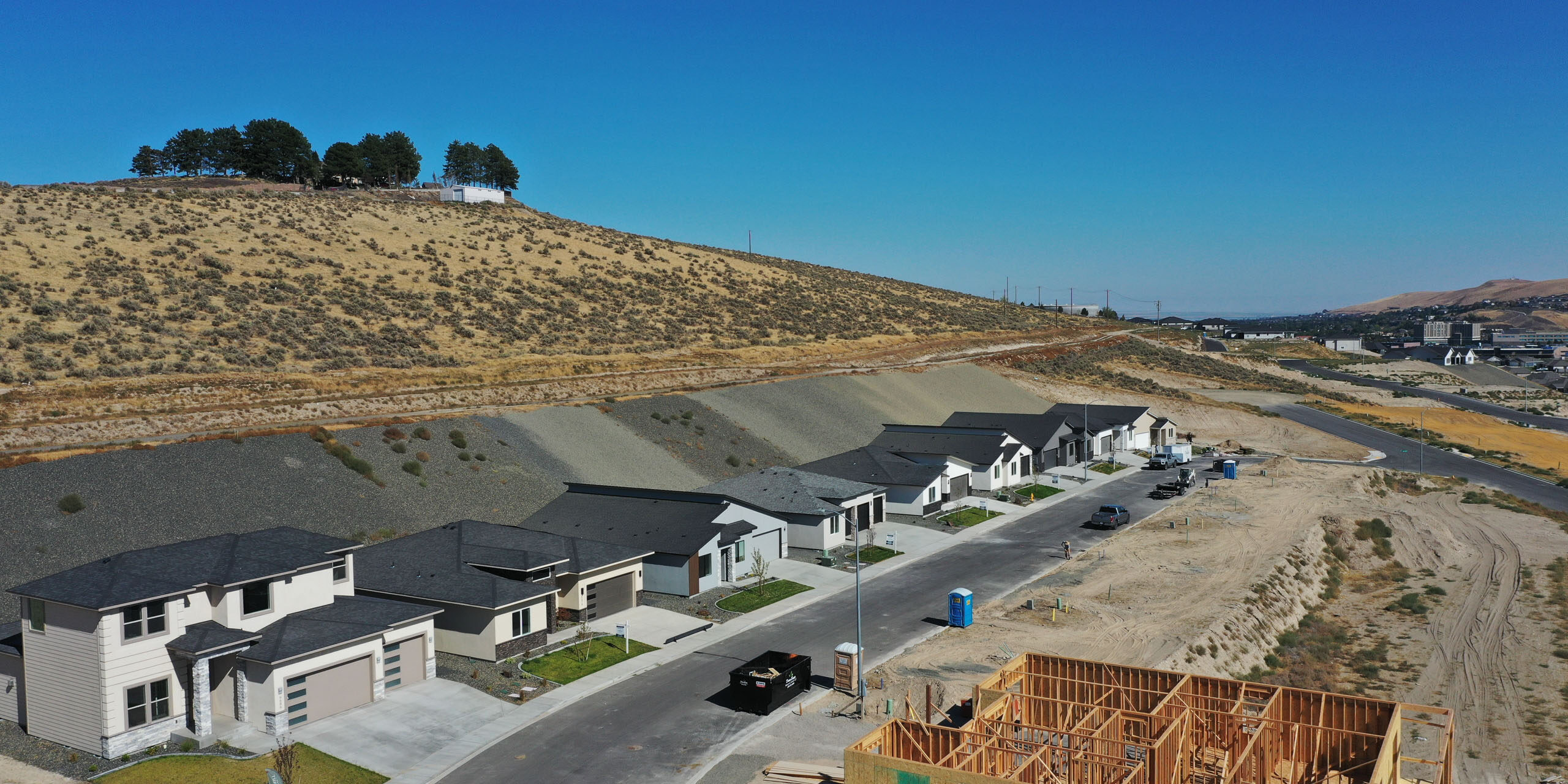 Construction site and modern houses in desert area.