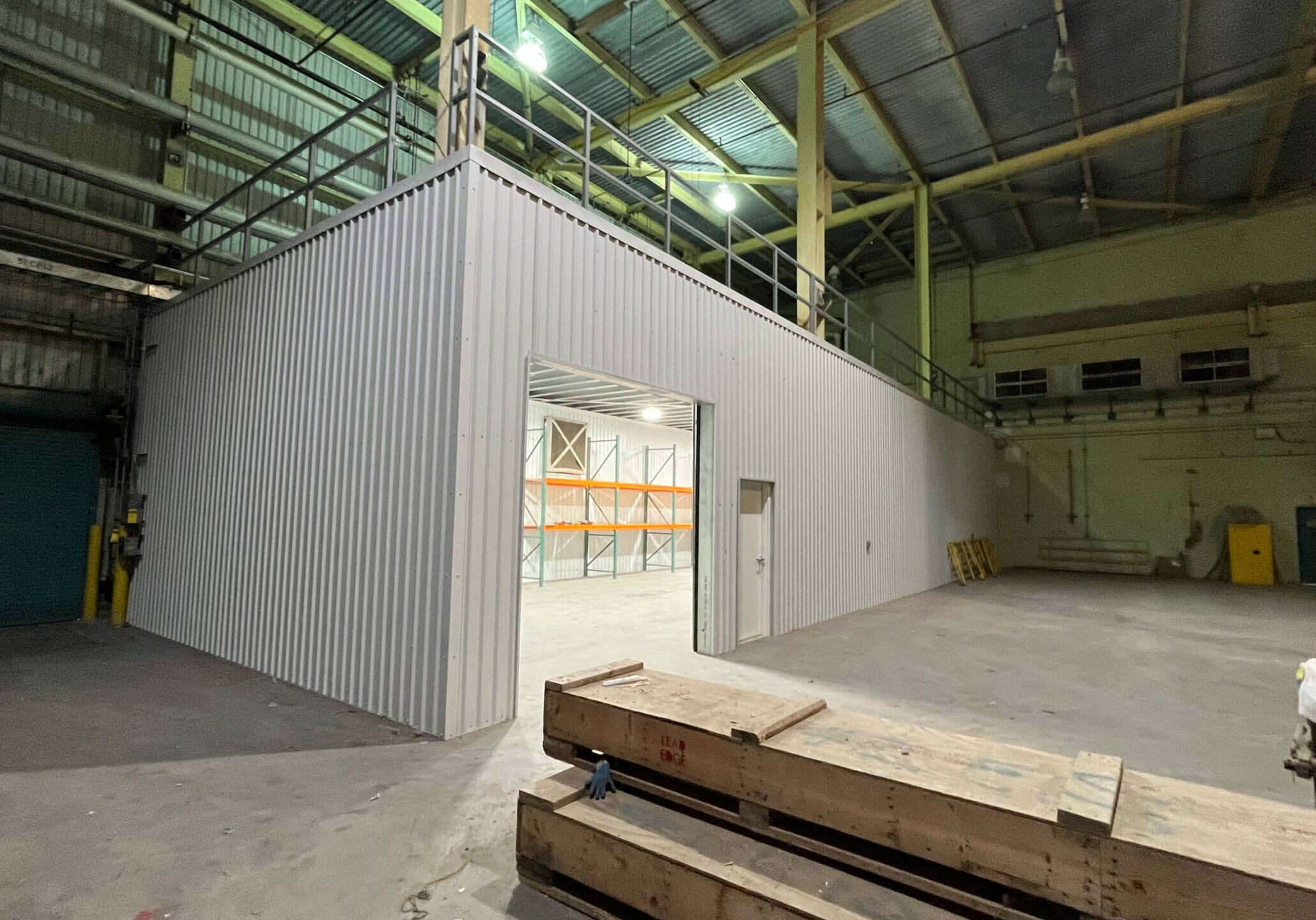 Empty industrial warehouse interior with metal partition
